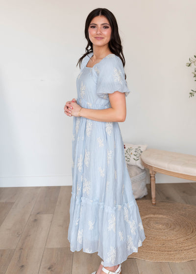 Side view of the light blue embroidered dress