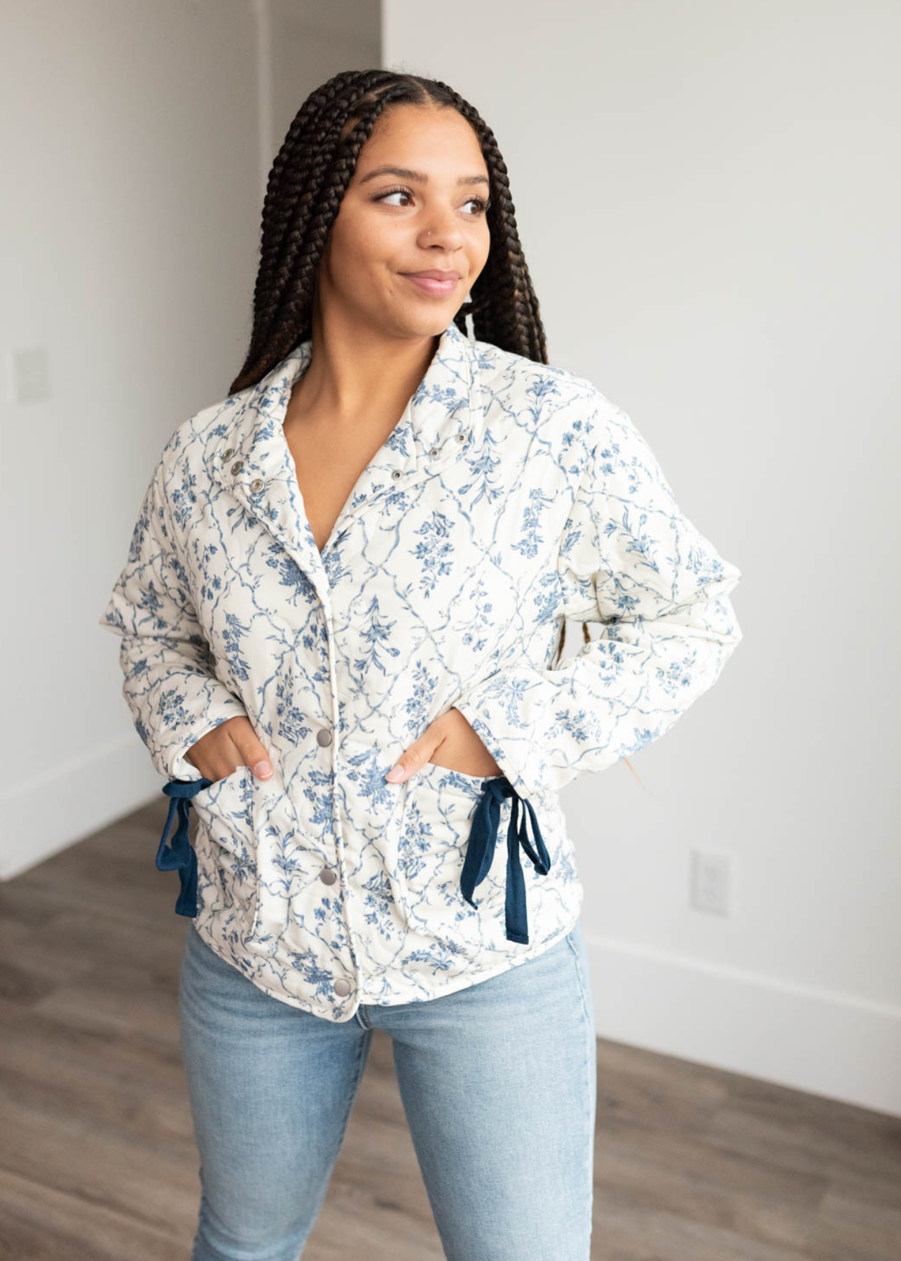 Cream flroal printed jacket with blue bows