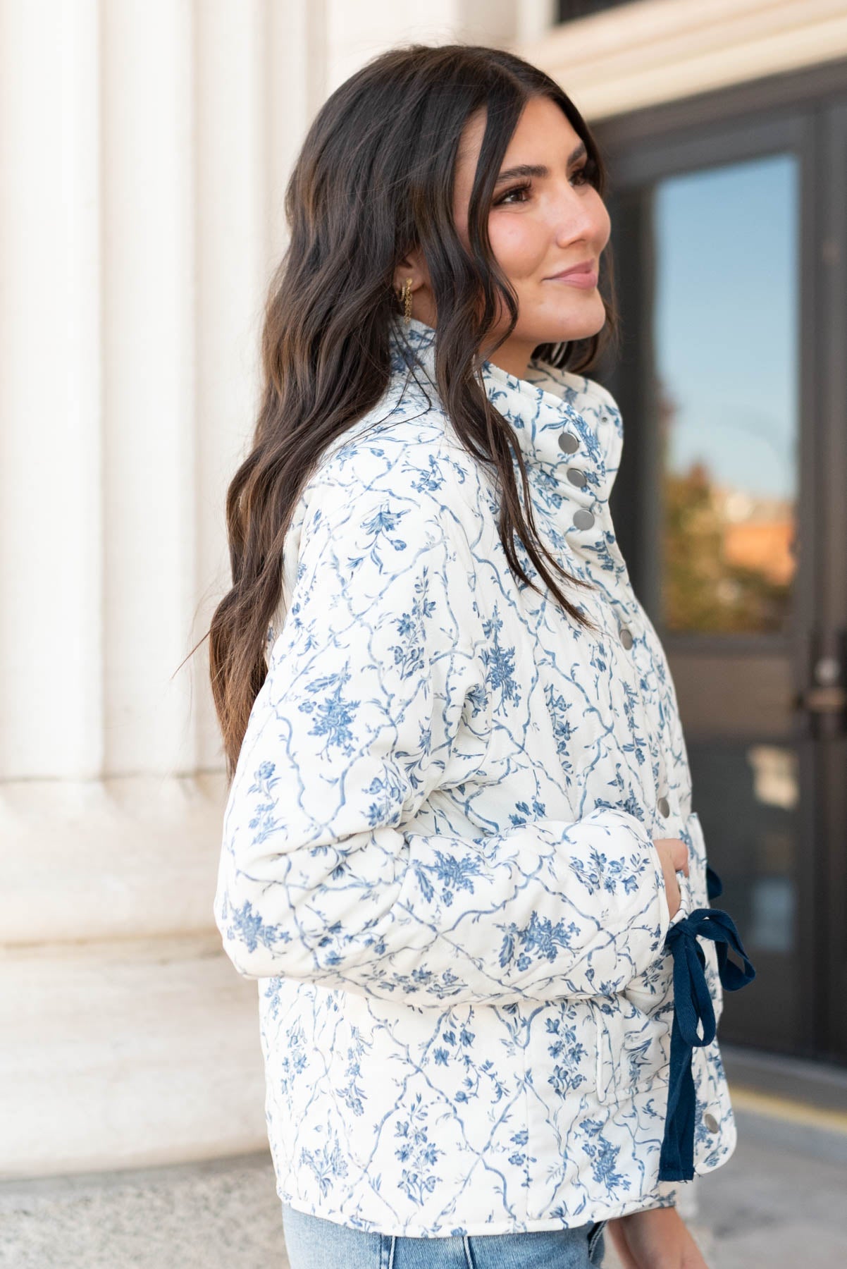 Side view of the cream floral printed jacket