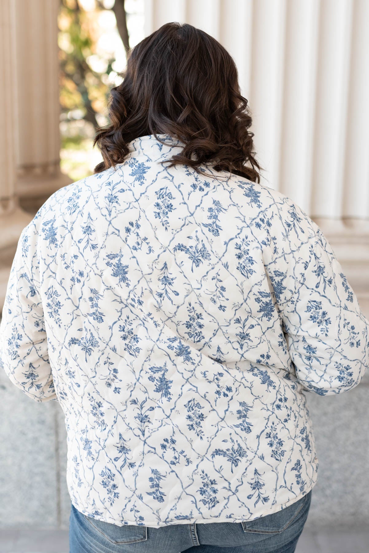 Back view of the plus size cream floral printed jacket