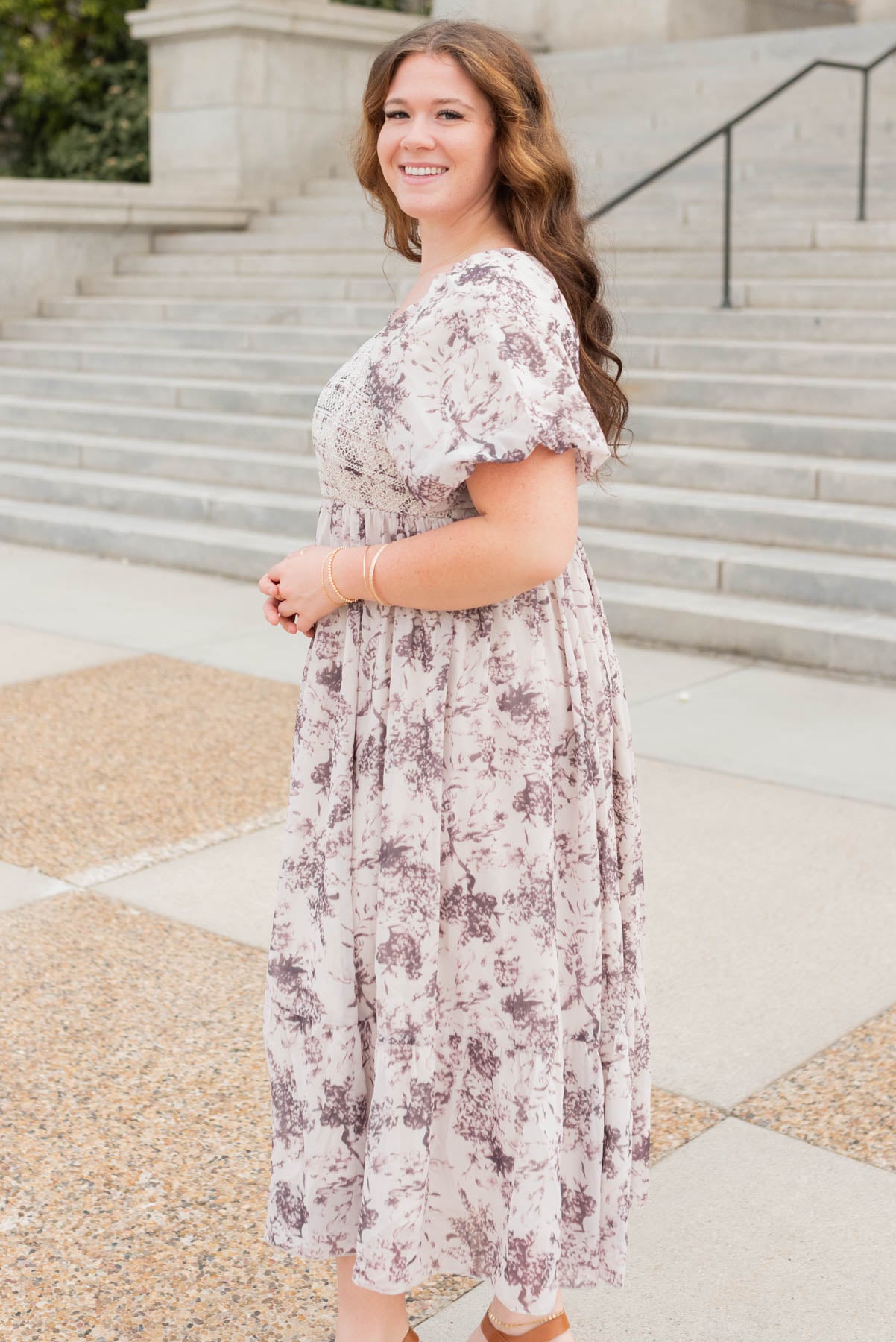 Side view of the cream floral smocked dress in plus size