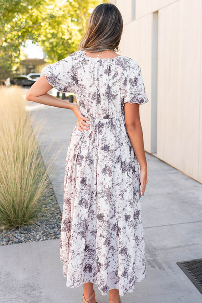 Back view of the cream floral smocked dress