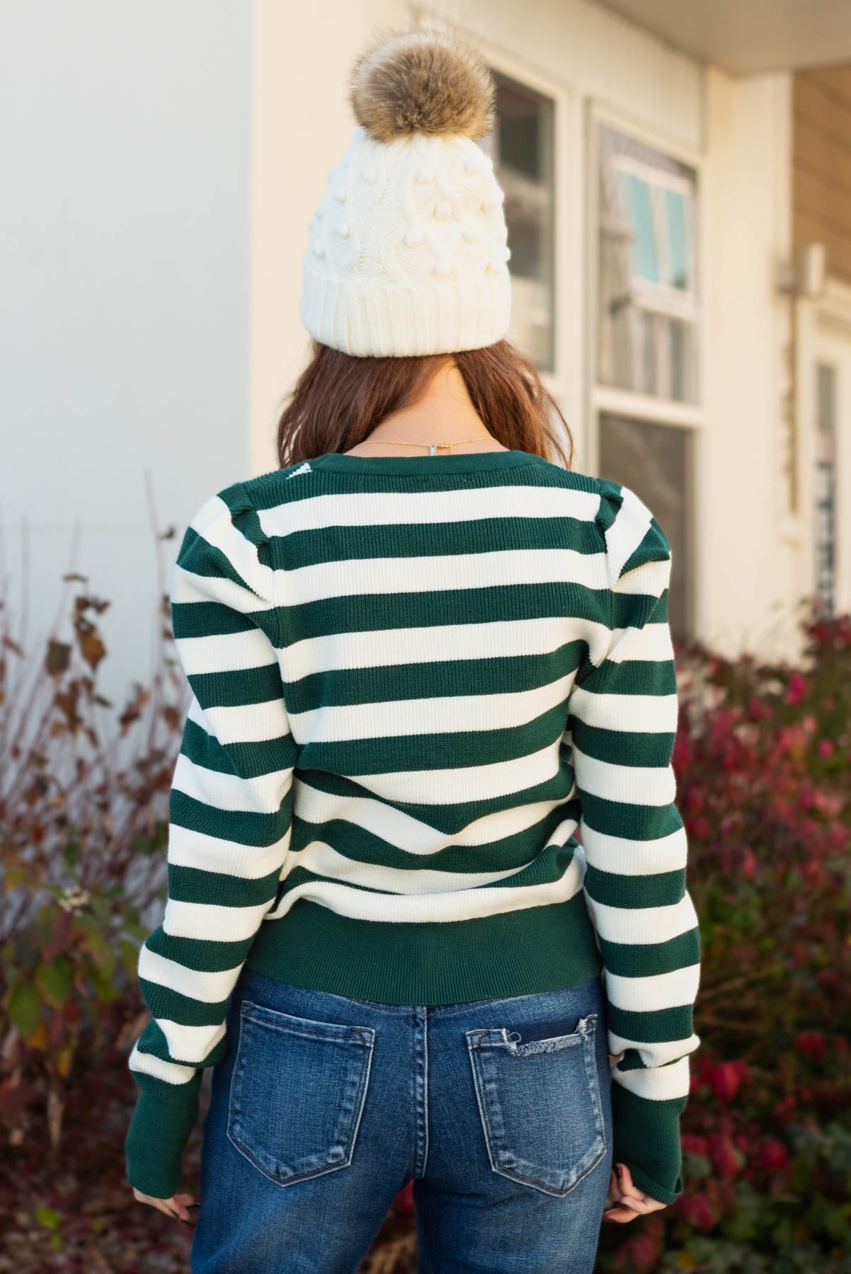 Back view of the hunter green striped sweater