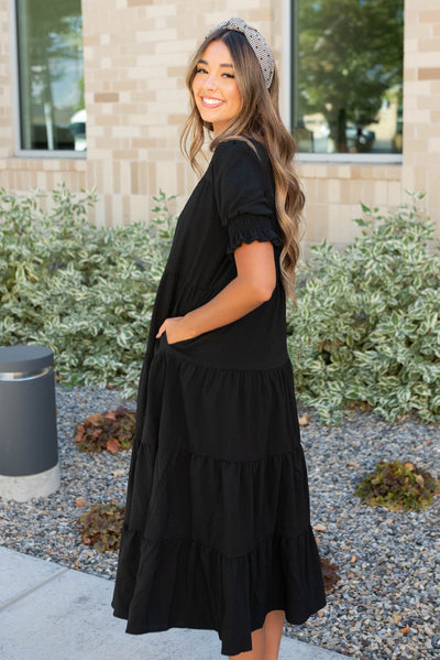 Side view of the tiered black dress