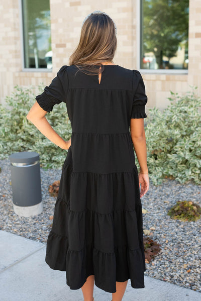 Back view of the tiered black dress