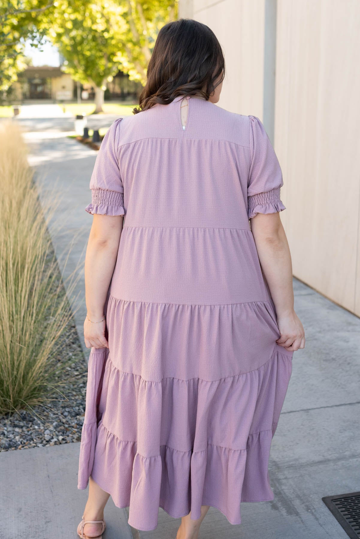 Back view of the plus size dusty lilac dress