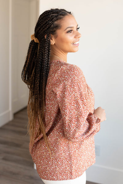 Side view of the rust floral top