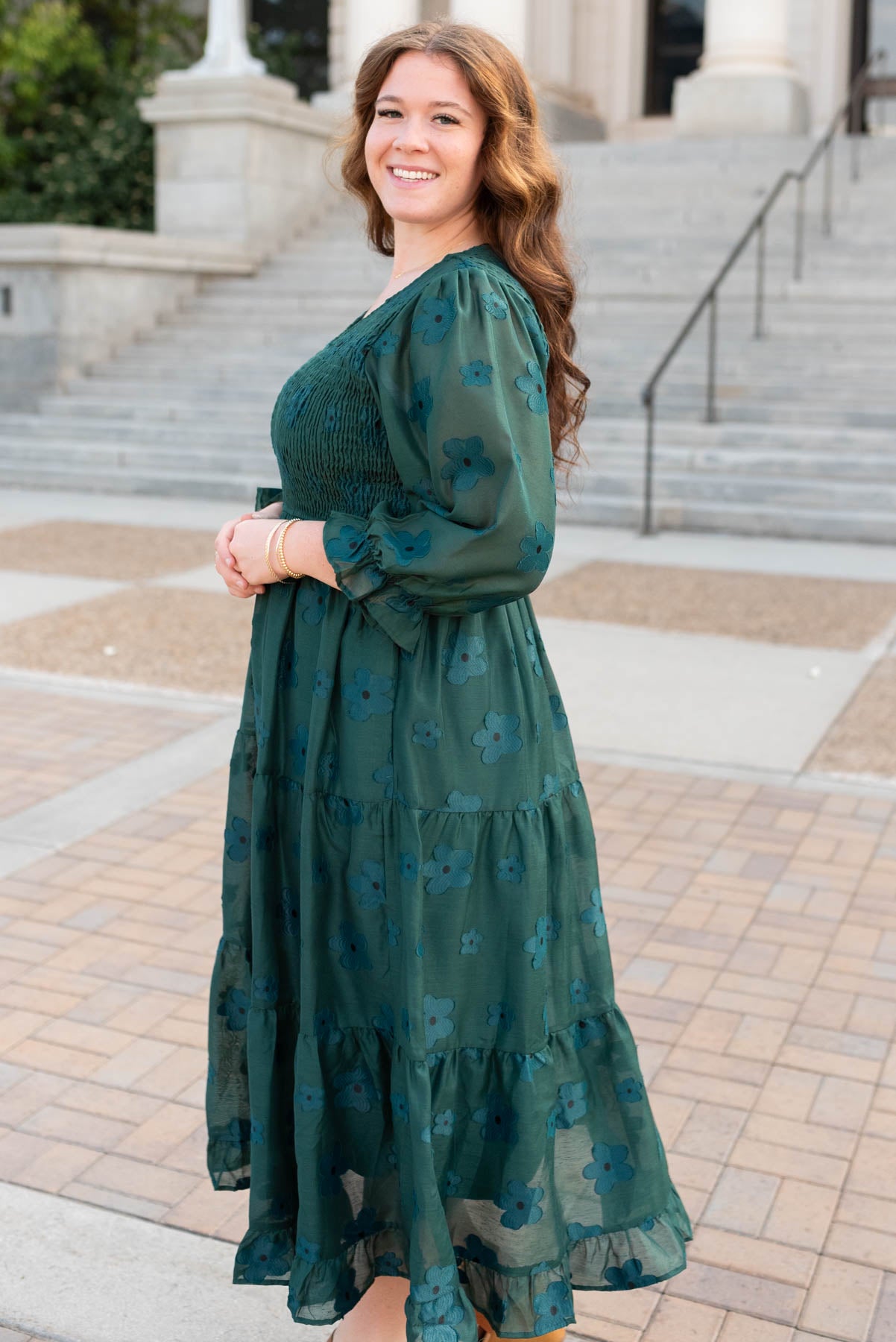 Side view of the plus size dark green floral dress