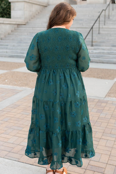 Back view of the dark green floral dress in plus size