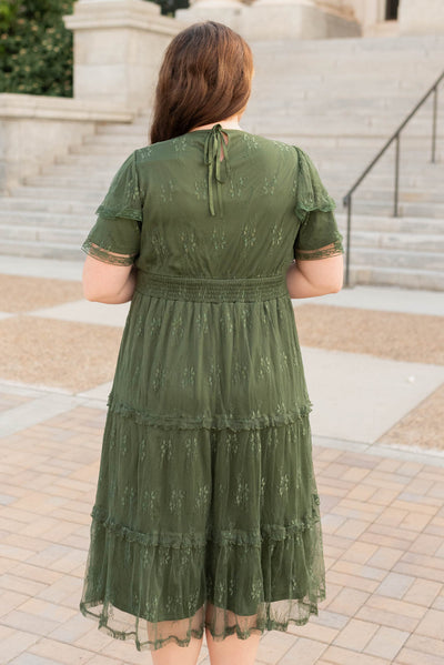 Back view of the dark green floral lace dress