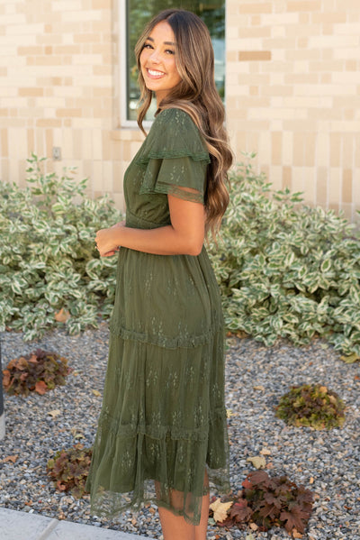 Side view of the dark green floral lace dress