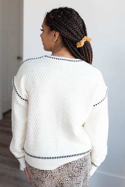 Back view of the cream textured sweater