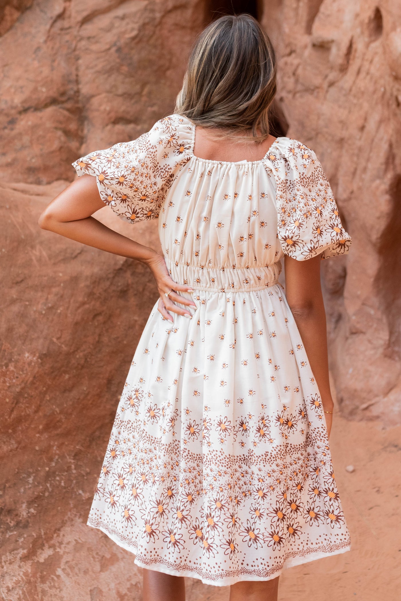 Back view of the beige daisy dress