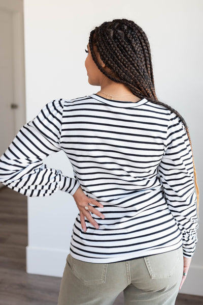 Back view of the black stripe long sleeve top