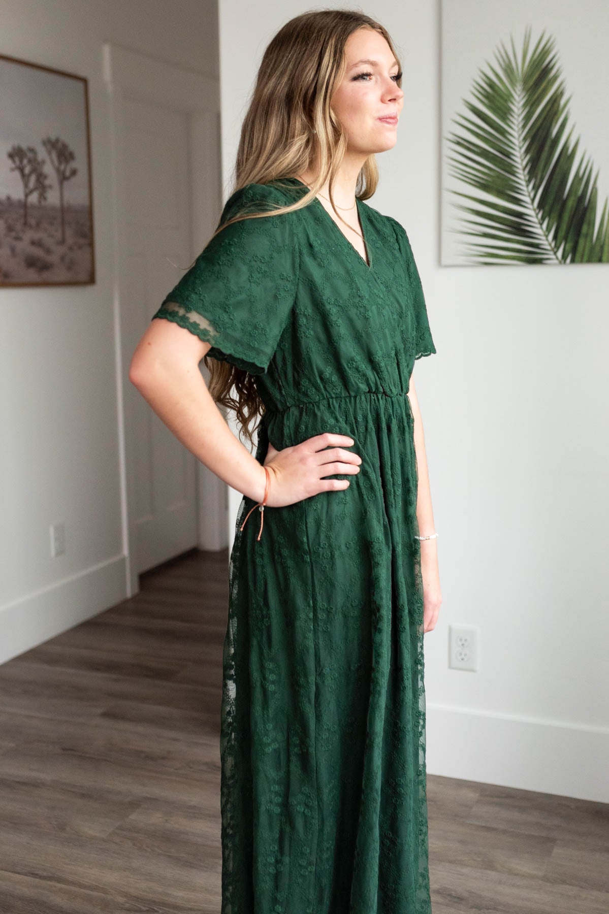 Side view of the hunter green lace floral dress