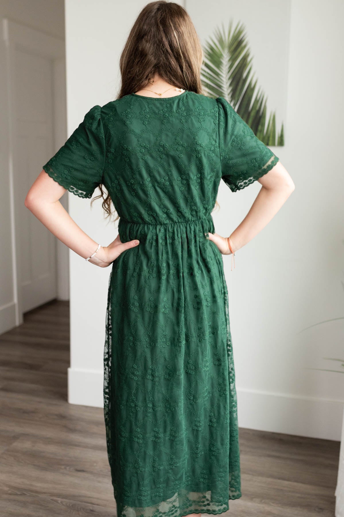 Back view of the hunter green lace floral dress