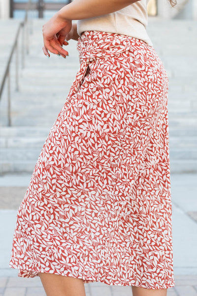 Side view of the rust floral knot skirt