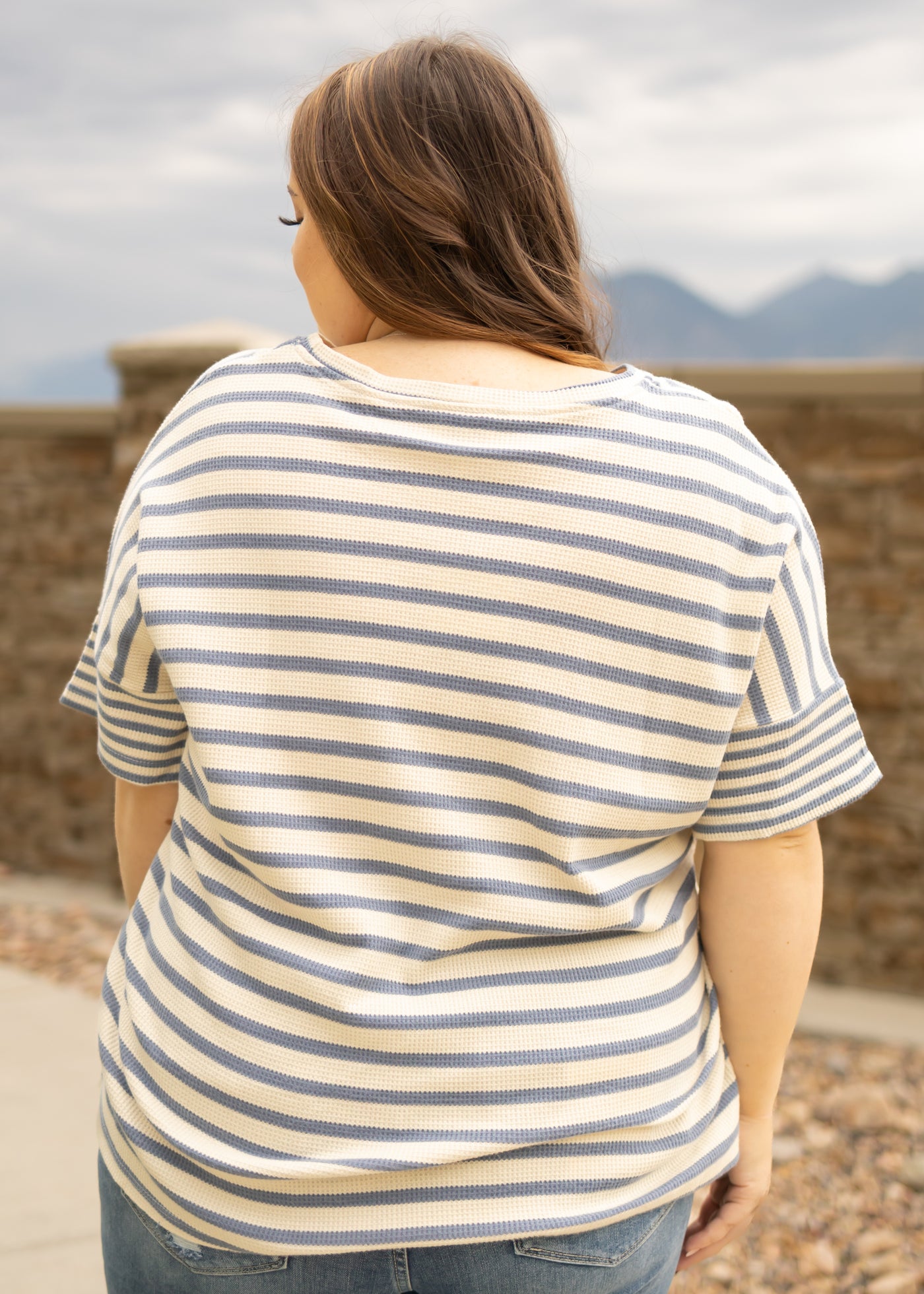 Back view of a plus size denim top