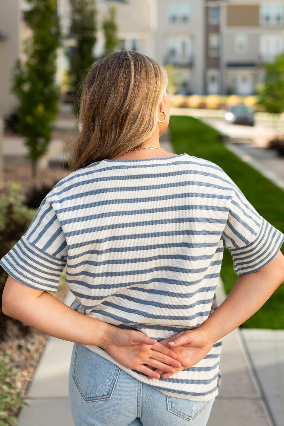 Back view of a stripe denim top