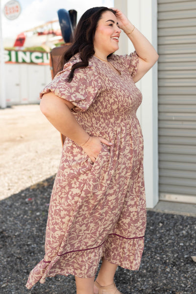 Side view of the dusty plum floral dress