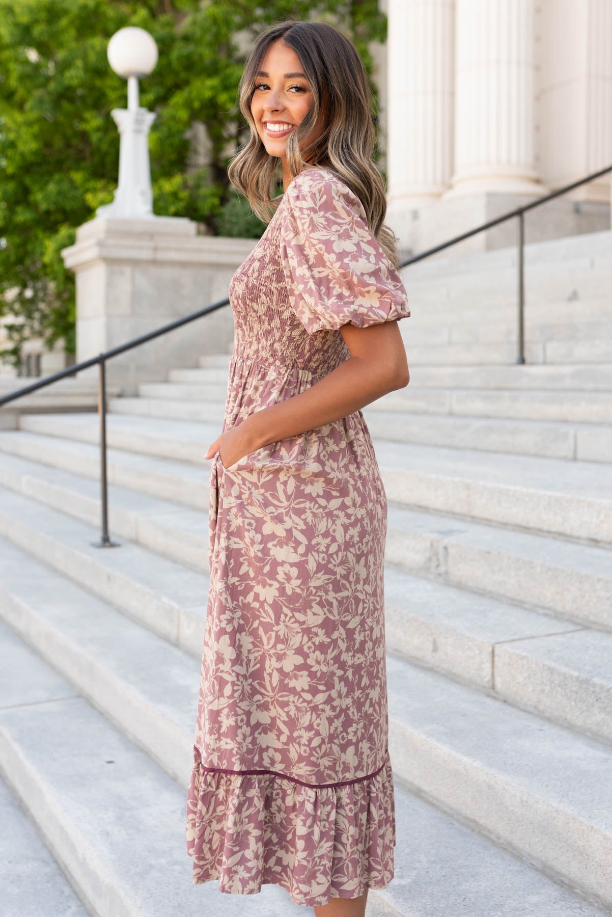 Side view of the dusty plum floral dress