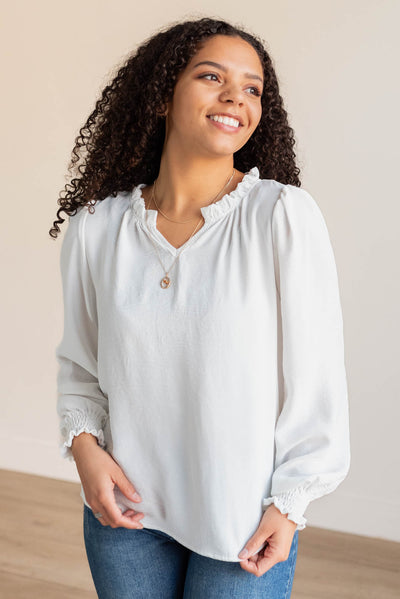 White top with long sleeves