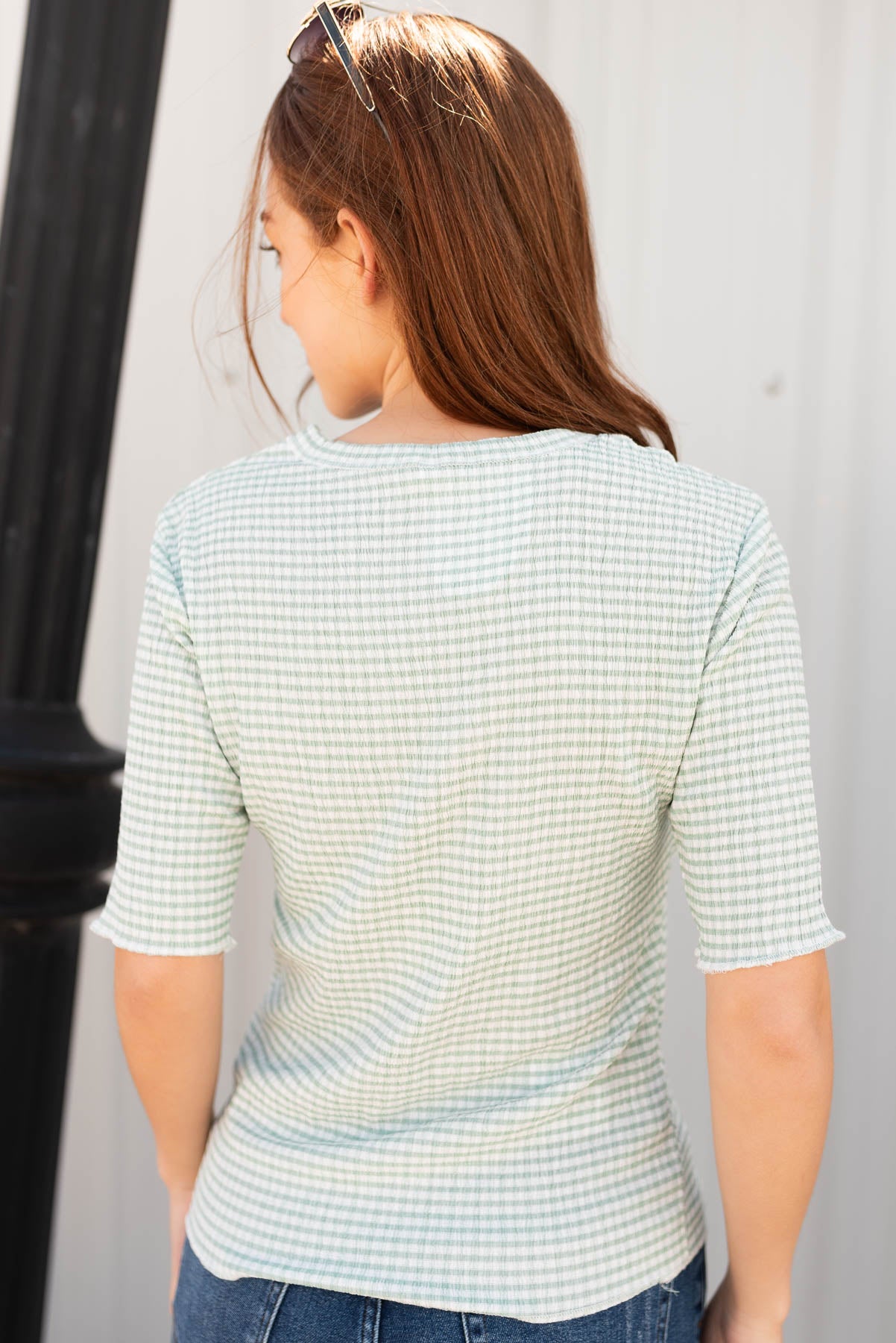Back view of the the sage plaid top