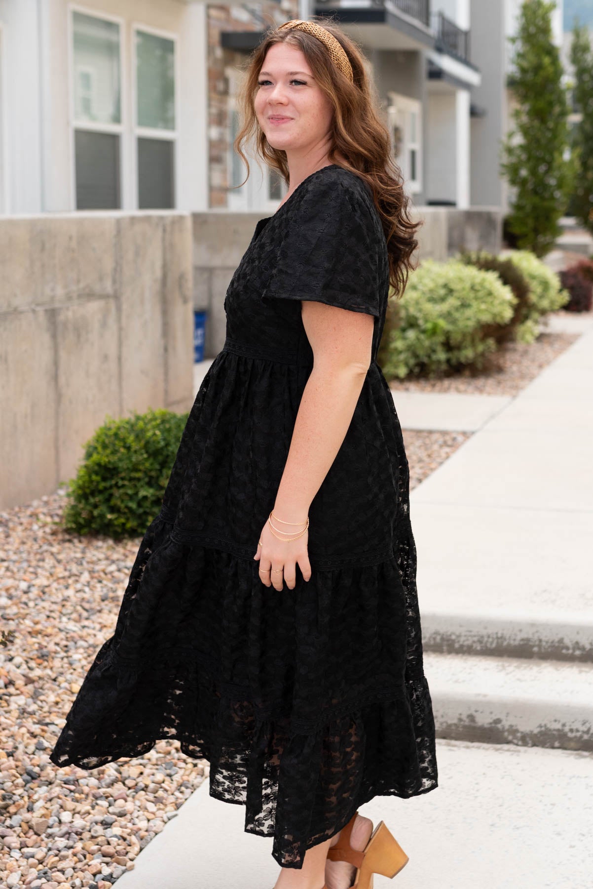 Side view of the plus size black floral lace dress