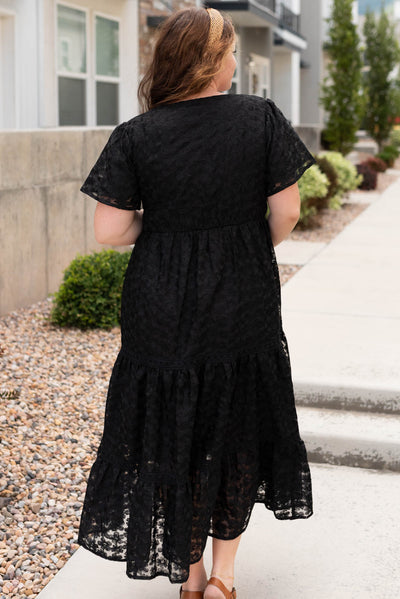 Back view of the plus size black floral lace dress