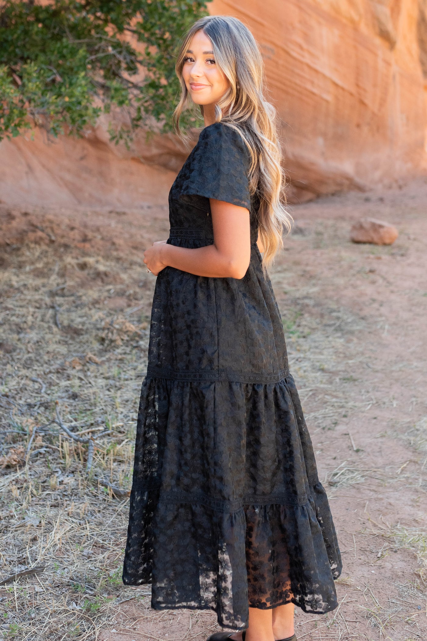 Side view of the black floral lace dress