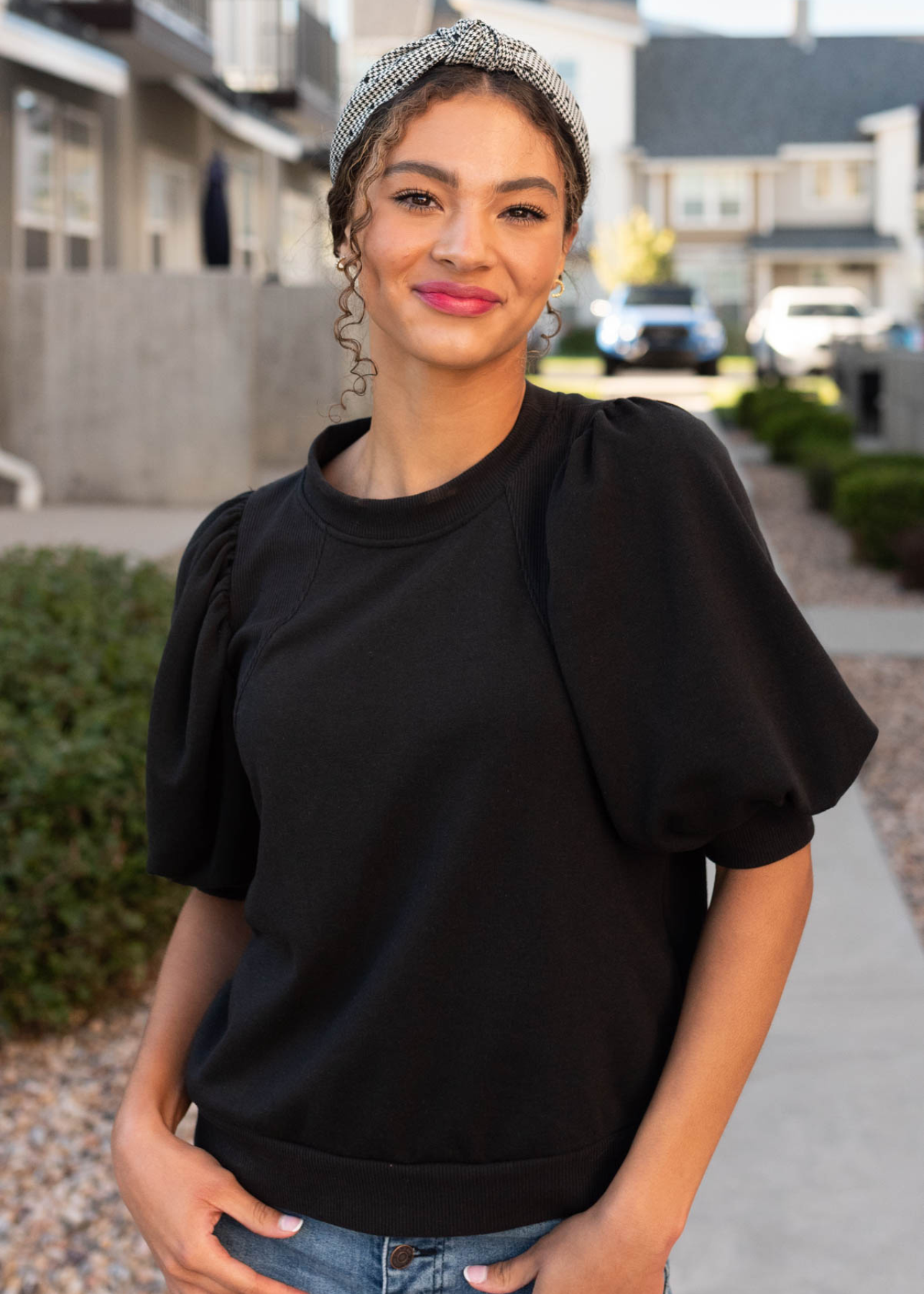 Close up of the black puff sleeve pullover