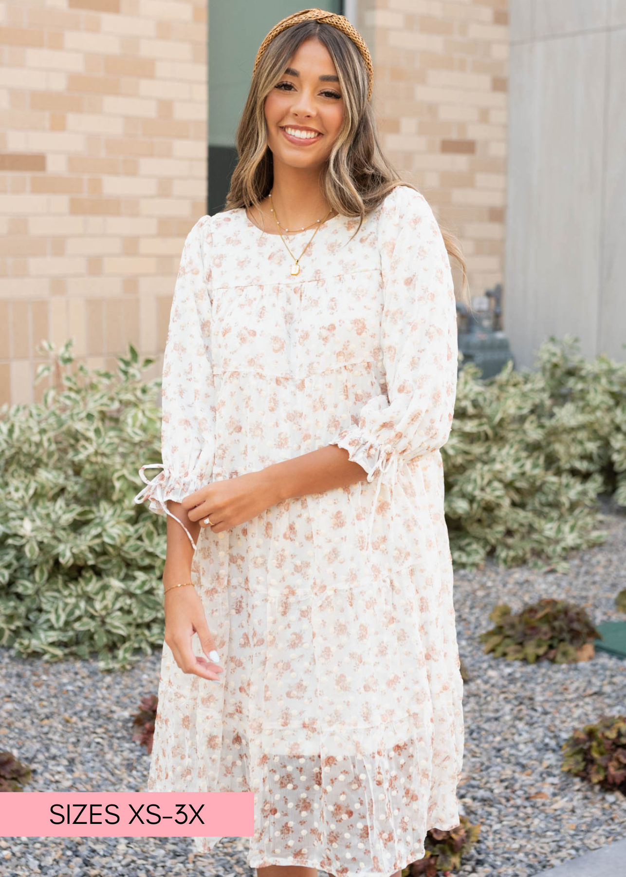 Cream floral dot dress with ties on the cuffs