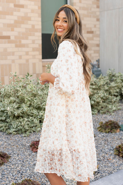 Side view of the cream floral dot dress