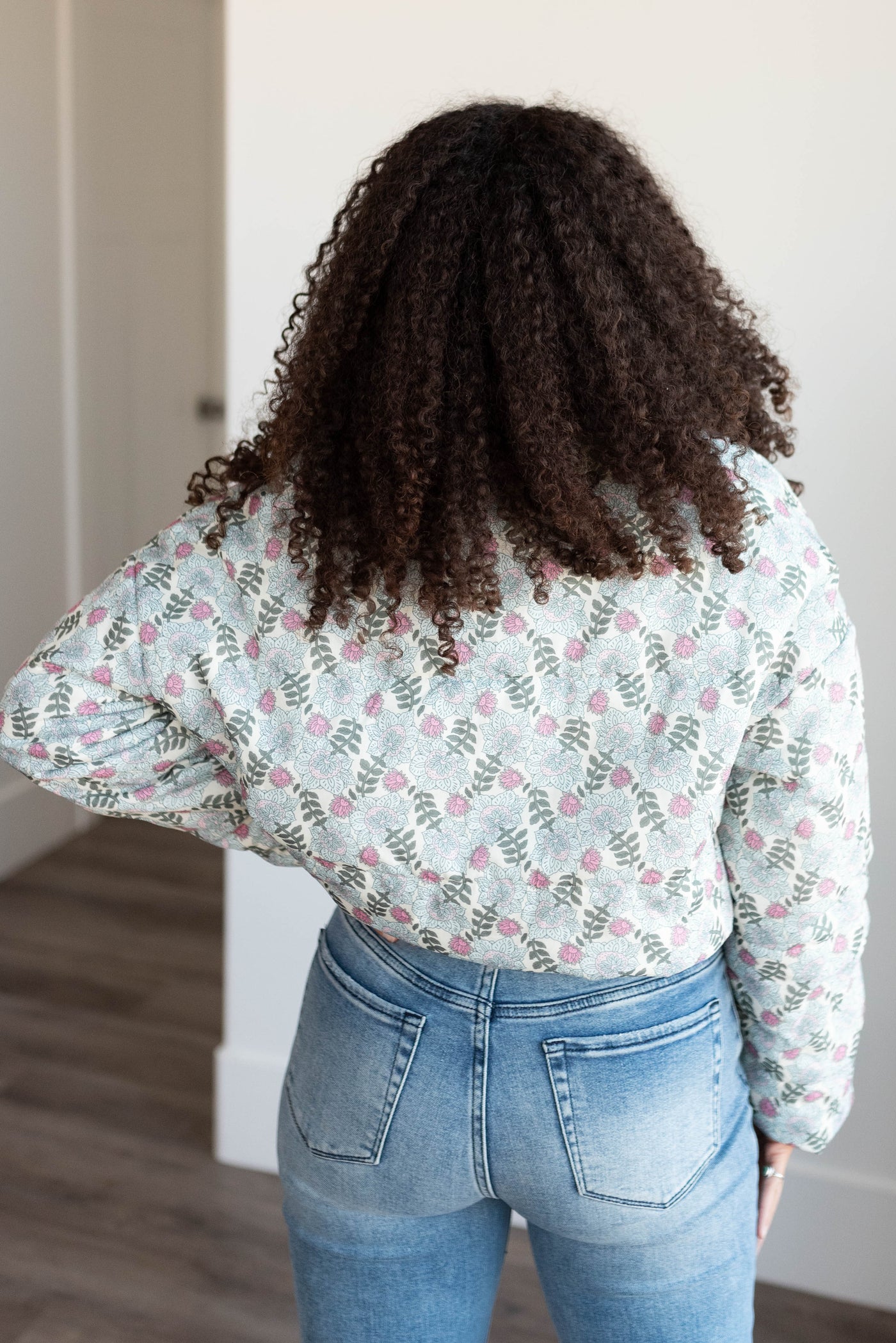 Back view of the sage floral puffer jacket