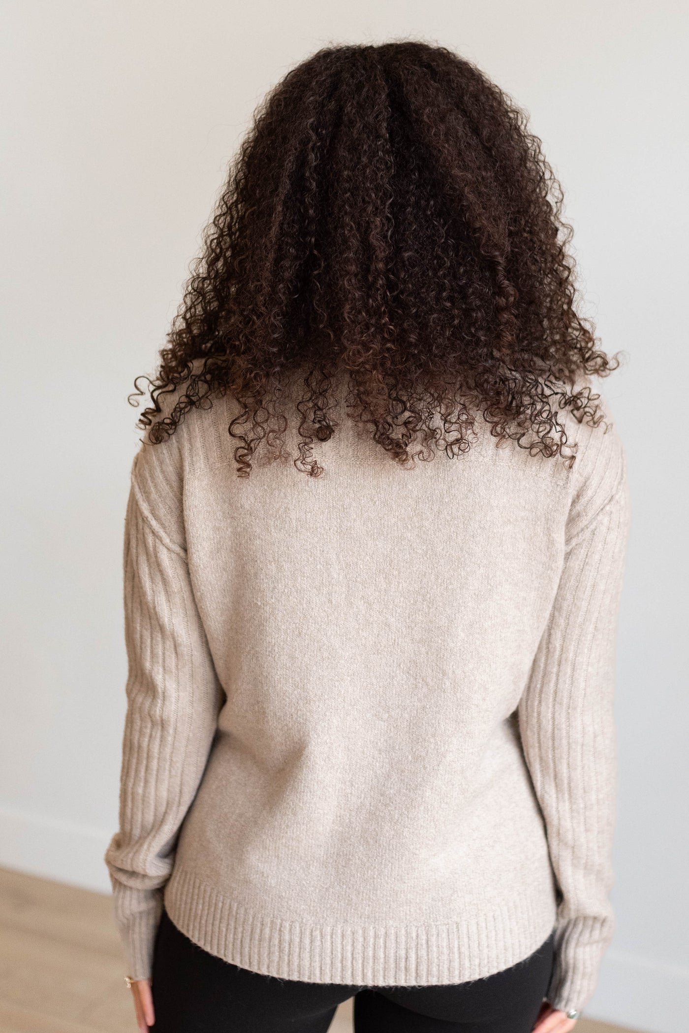 Back view of the heather khaki knit sweater