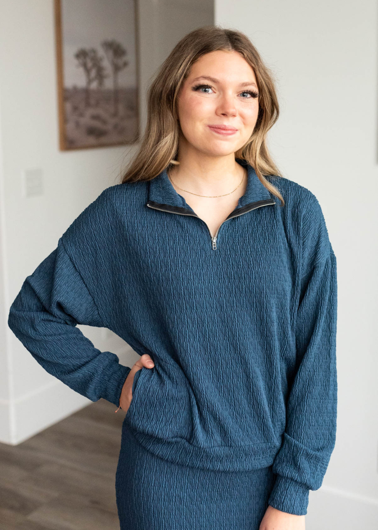 Navy knit pullover with front pockets