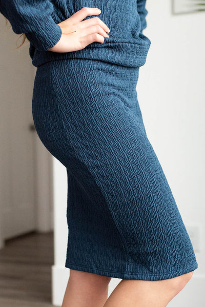 Side view of the navy knit skirt