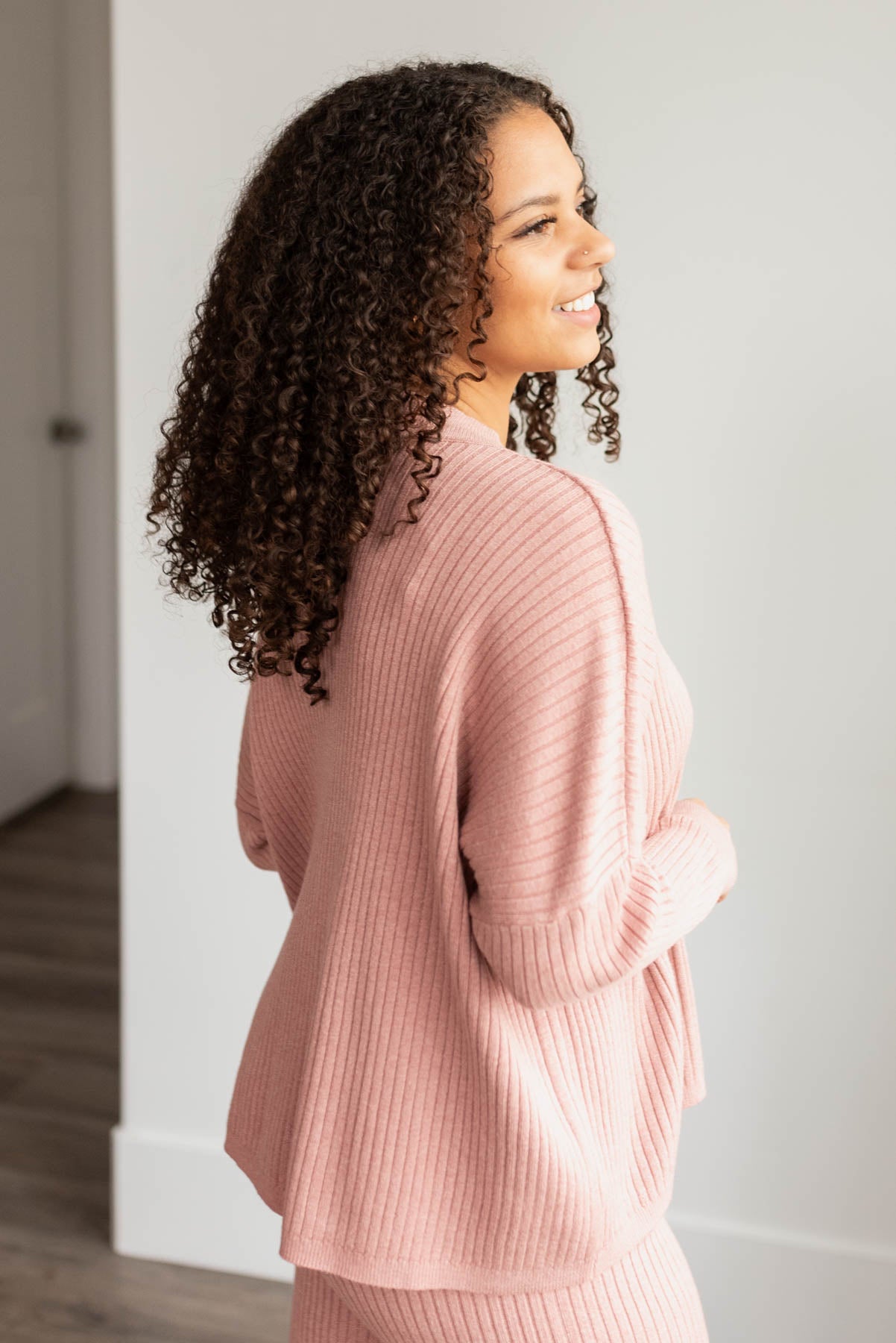 Side view of the blush sweater