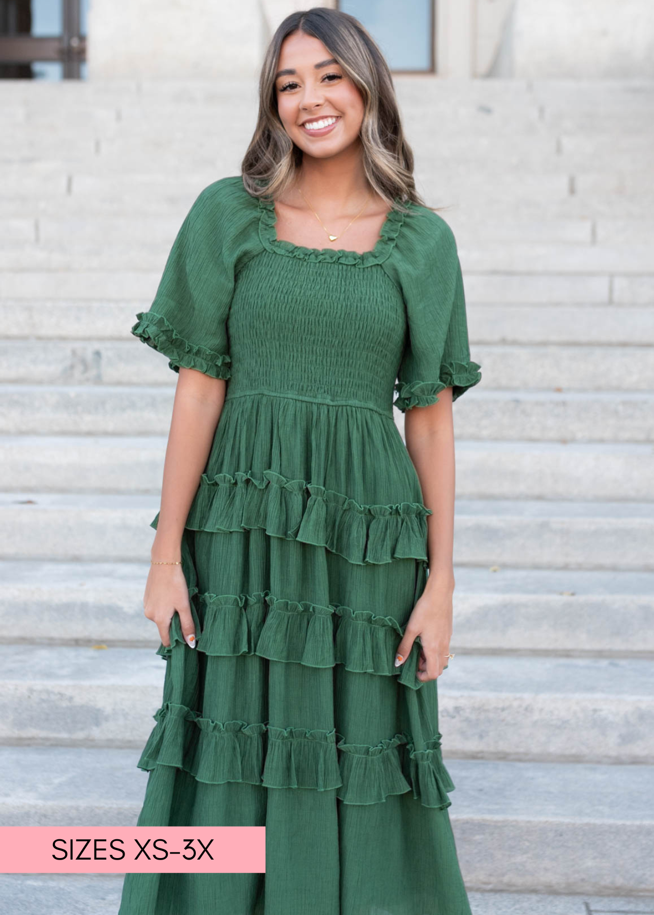 Small green ruffle tiered dress with smocked bodice