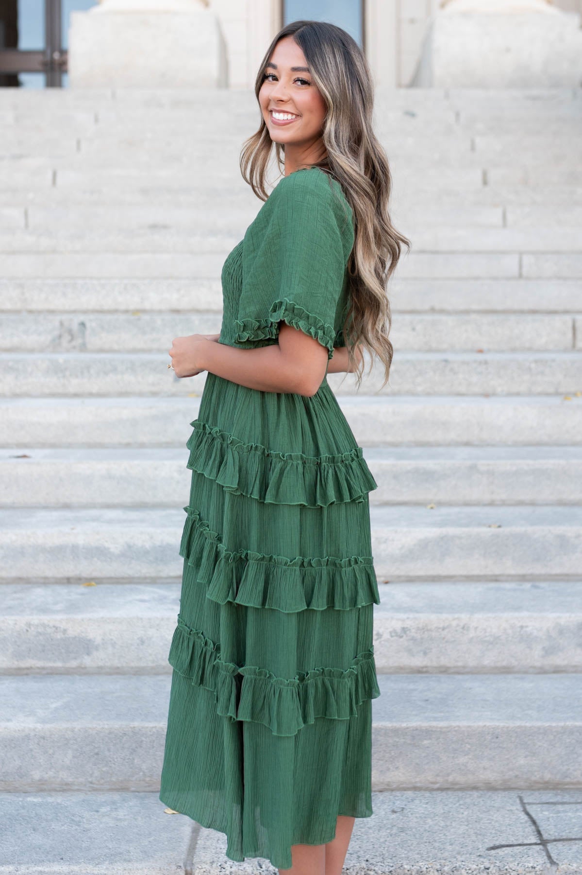 Side view of the small green ruffle tiered dress