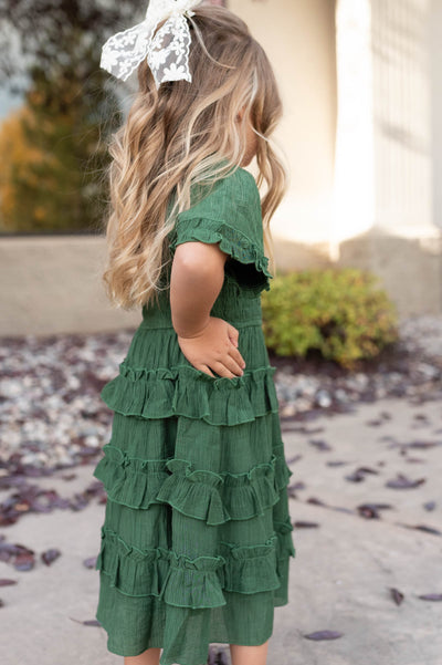 Side view of the green ruffle tiered little girl dress