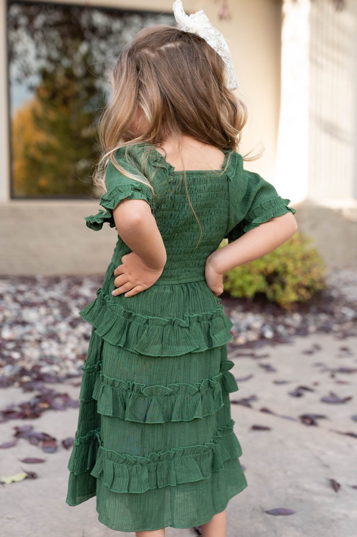 Back view of the green ruffle tiered little girl dress