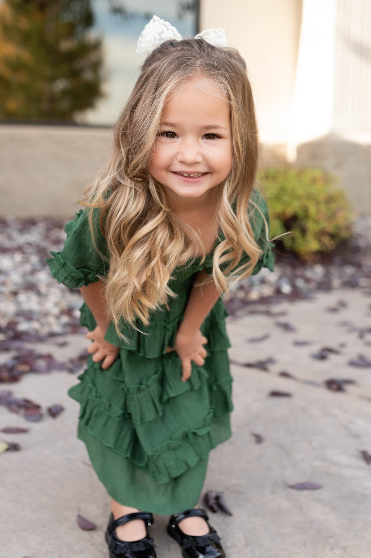 Green ruffle tiered little girl dress with ruffles on the skirt