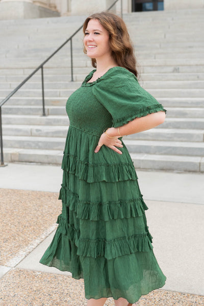 Side view of the green textured ruffle tiered dress in plus size