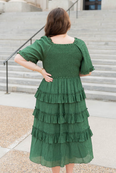 Back view of the plus size green textured ruffle tiered dress