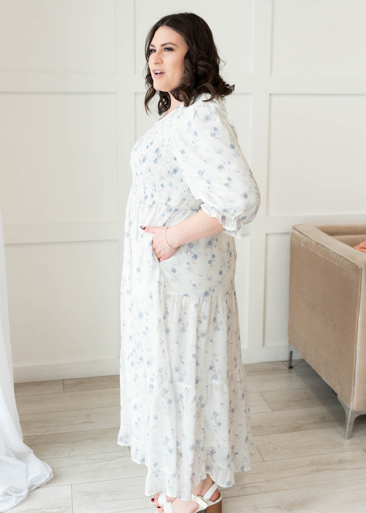 Side view of the plus size light blue floral tiered dress