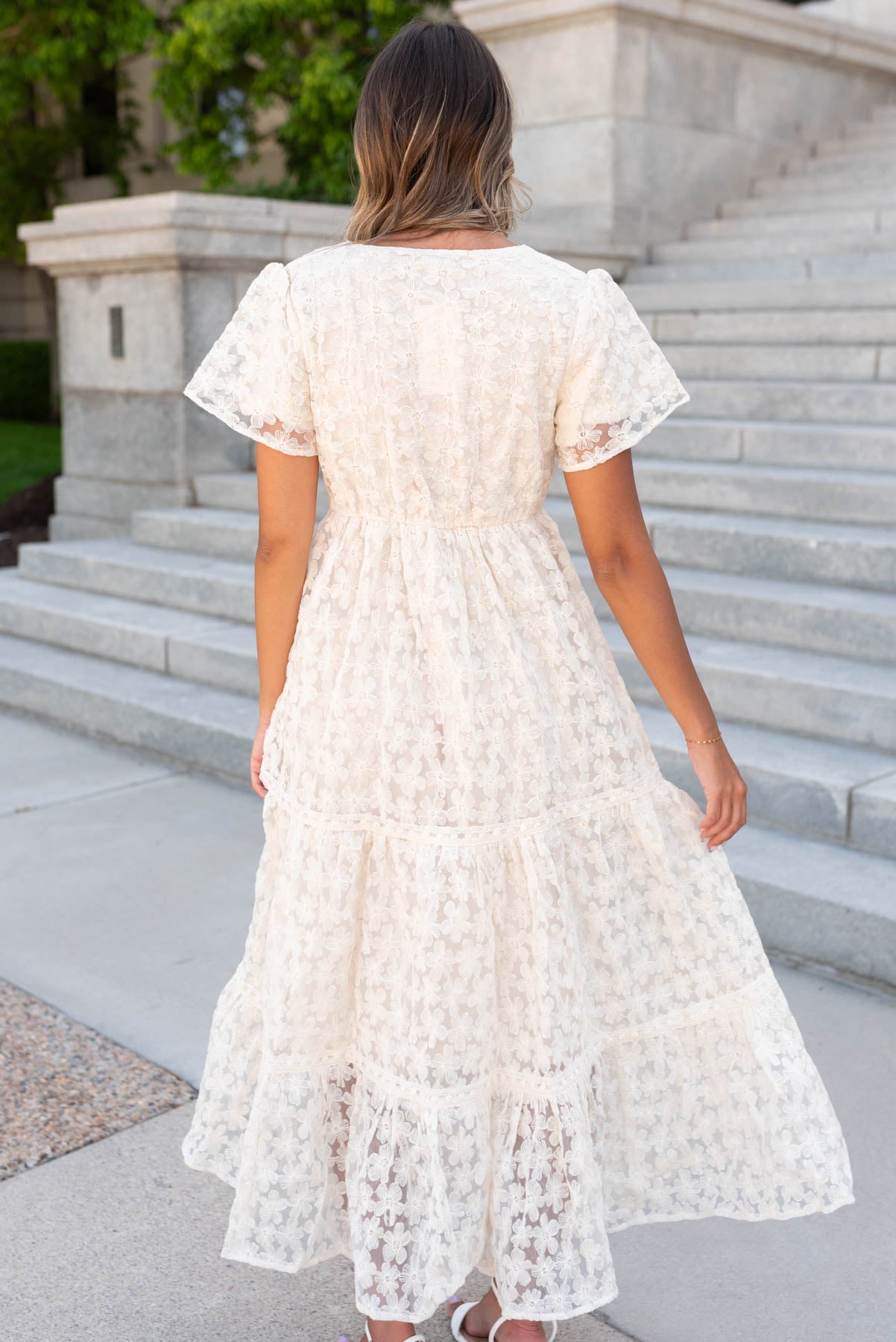 Back view of the cream floral lace dress