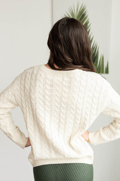 Back view of the cream embroidered tree sweater