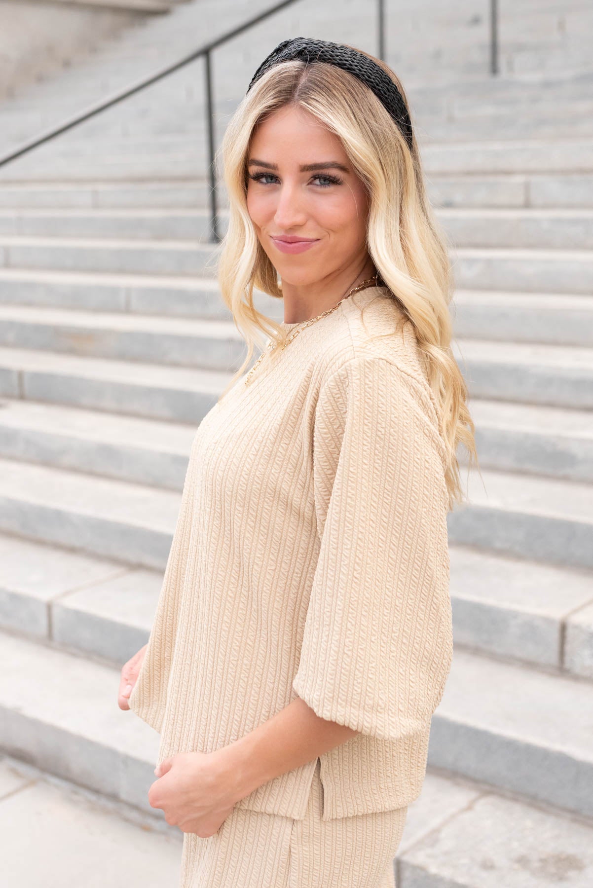 Side view of the beige textured top