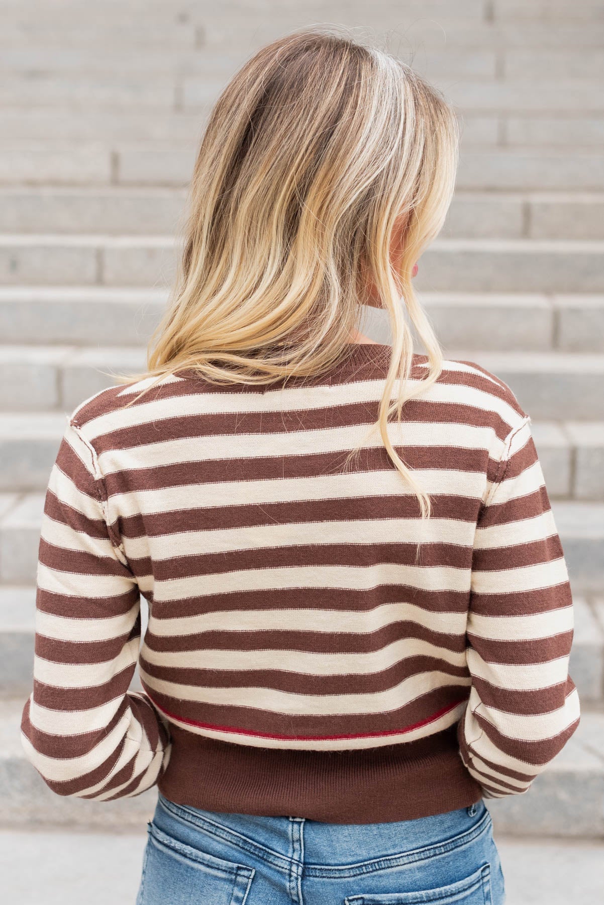 Back view of the brown button down sweater